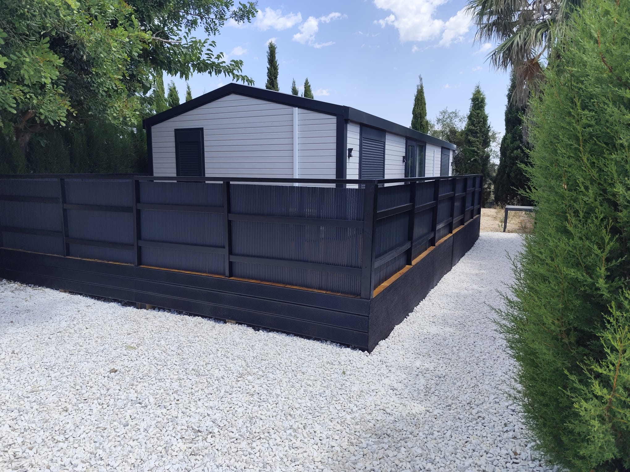 Completed mobile home with privacy fence